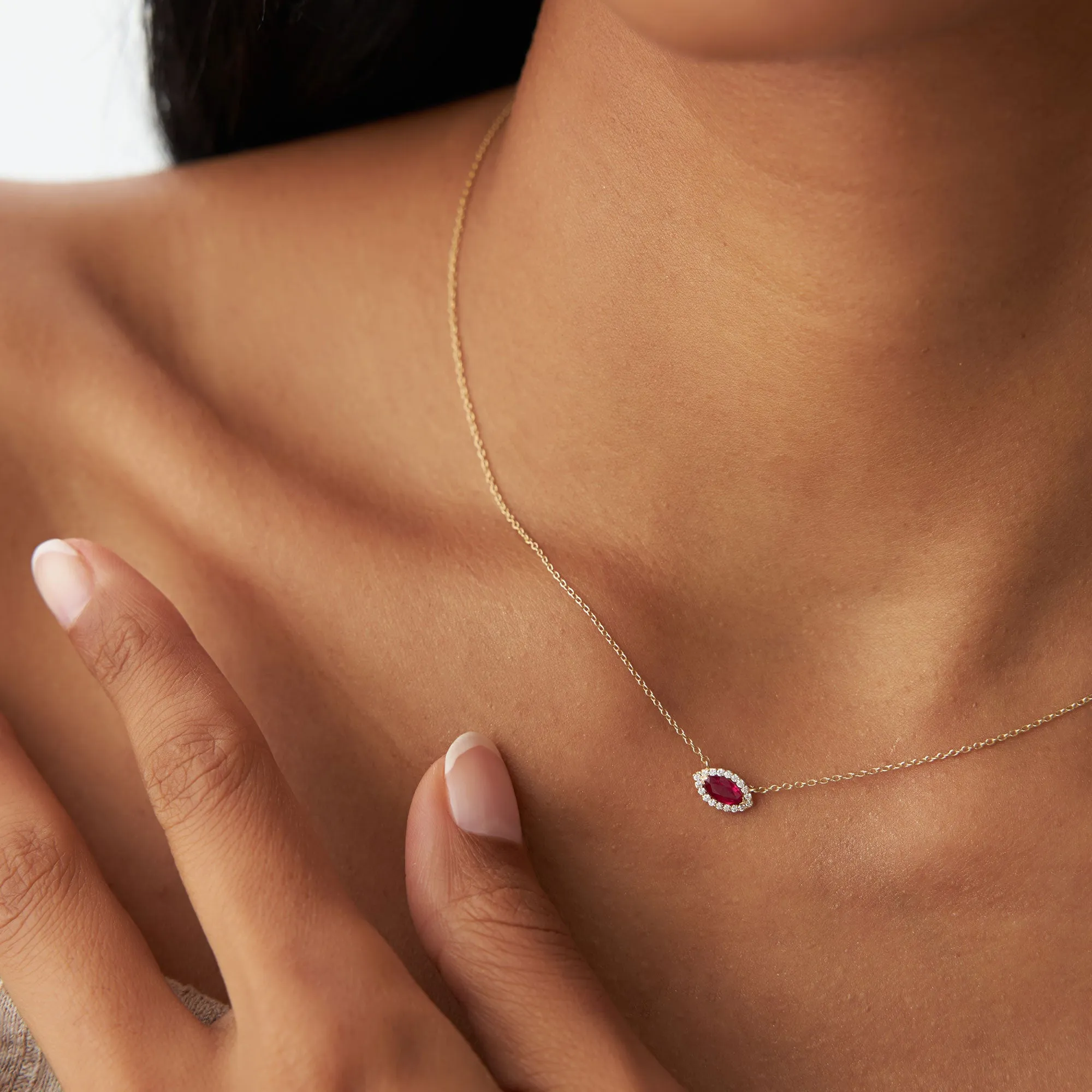 14k Marquise Ruby with Halo Diamond Setting
