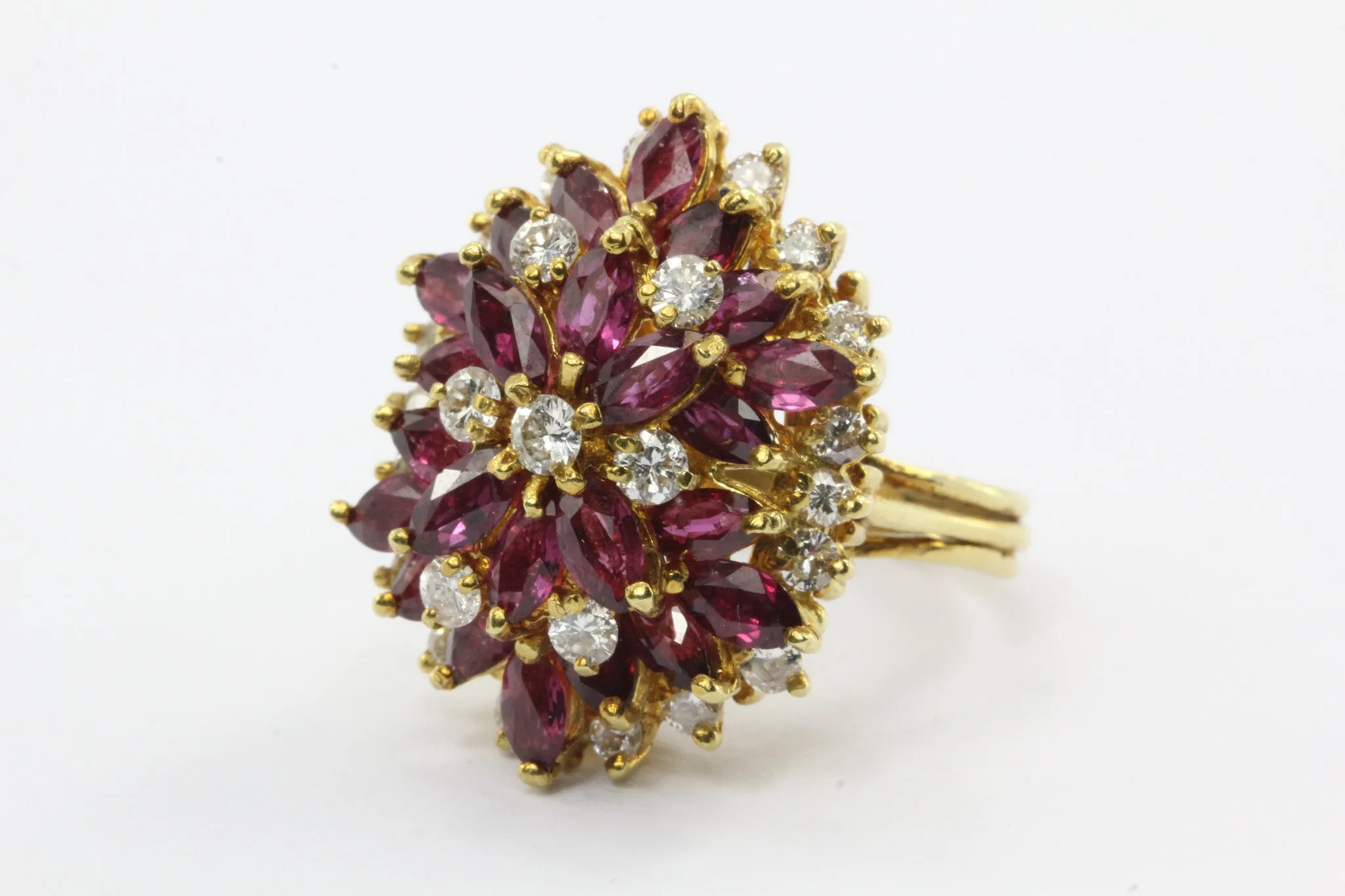 An 18k natural ruby and diamond cocktail ring featuring 5 carats of rubies and 1 carat of diamonds.