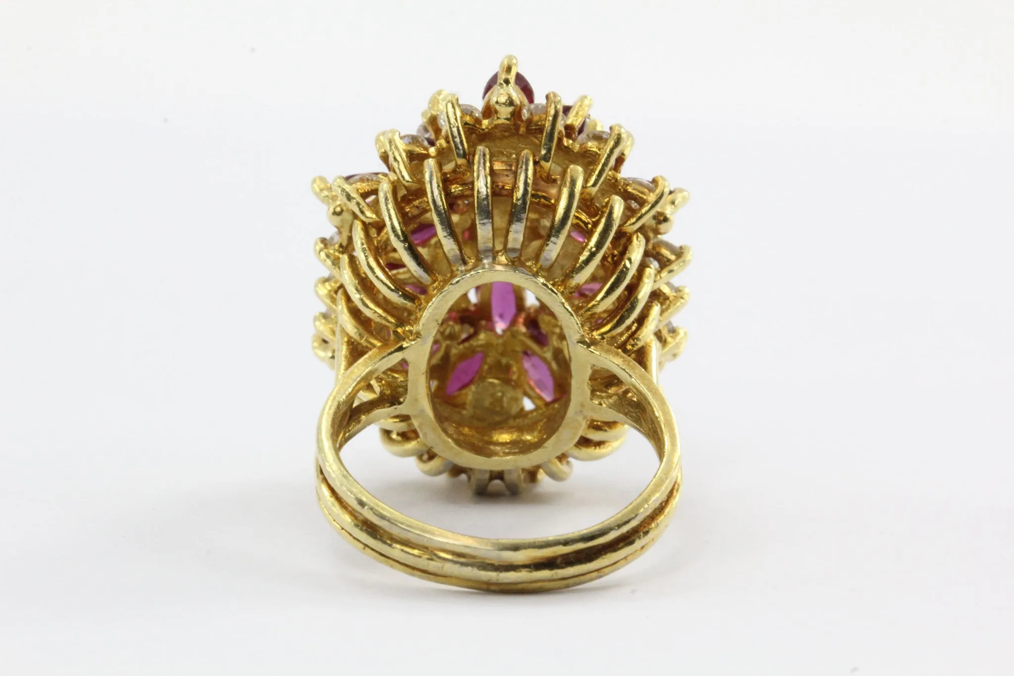 An 18k natural ruby and diamond cocktail ring featuring 5 carats of rubies and 1 carat of diamonds.