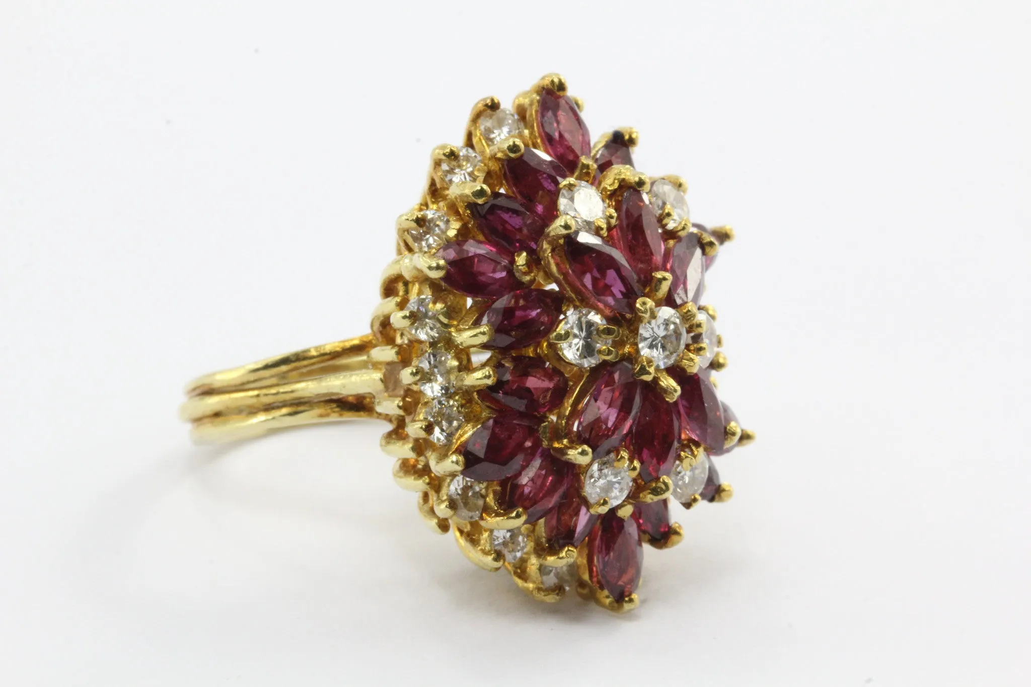 An 18k natural ruby and diamond cocktail ring featuring 5 carats of rubies and 1 carat of diamonds.