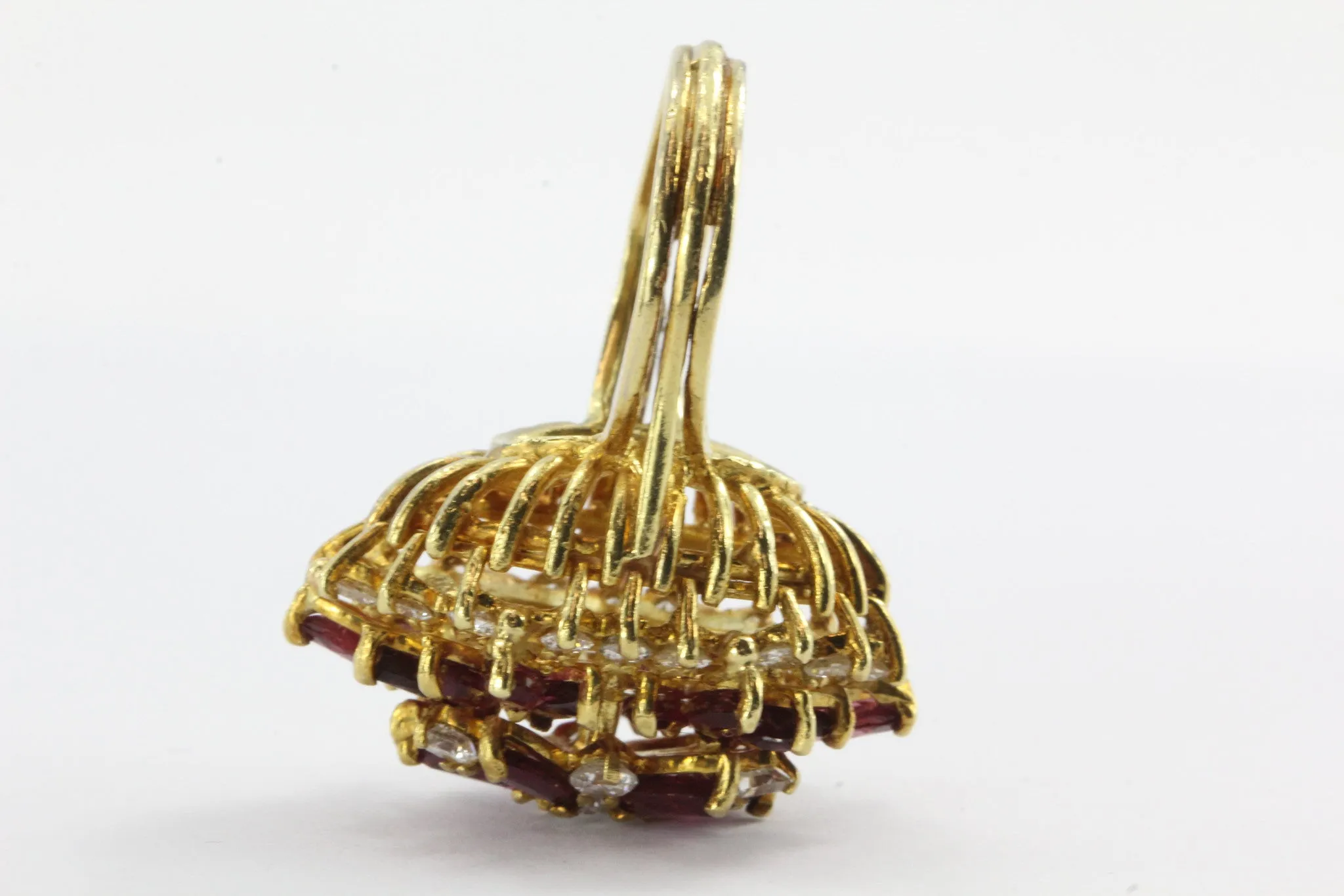 An 18k natural ruby and diamond cocktail ring featuring 5 carats of rubies and 1 carat of diamonds.