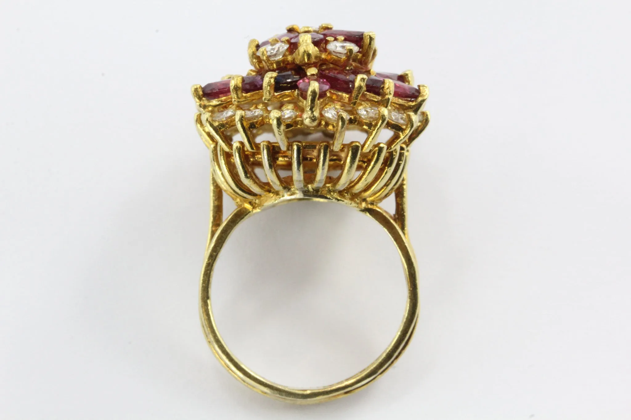 An 18k natural ruby and diamond cocktail ring featuring 5 carats of rubies and 1 carat of diamonds.