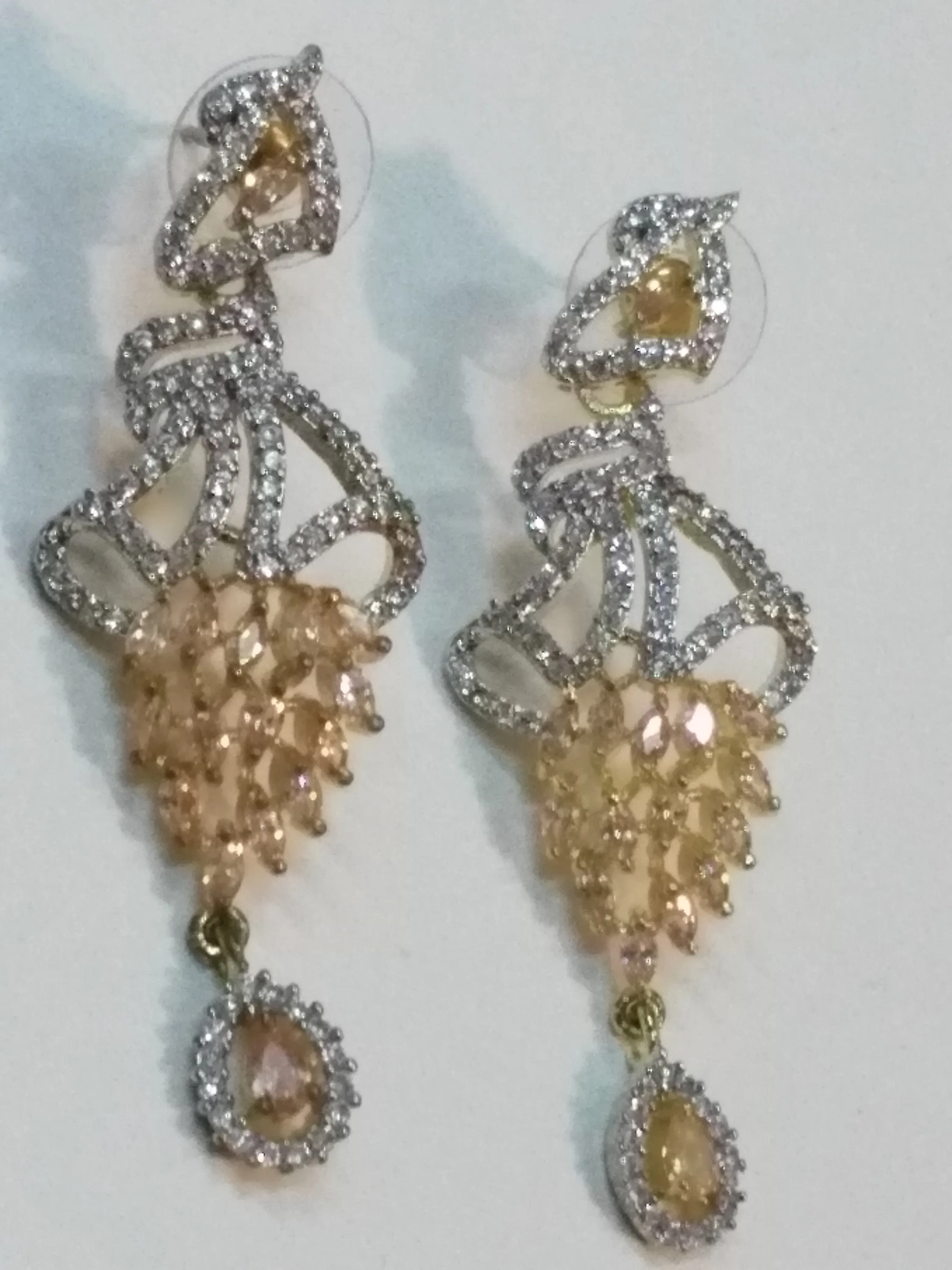 Inverted feather style champagne stones earrings