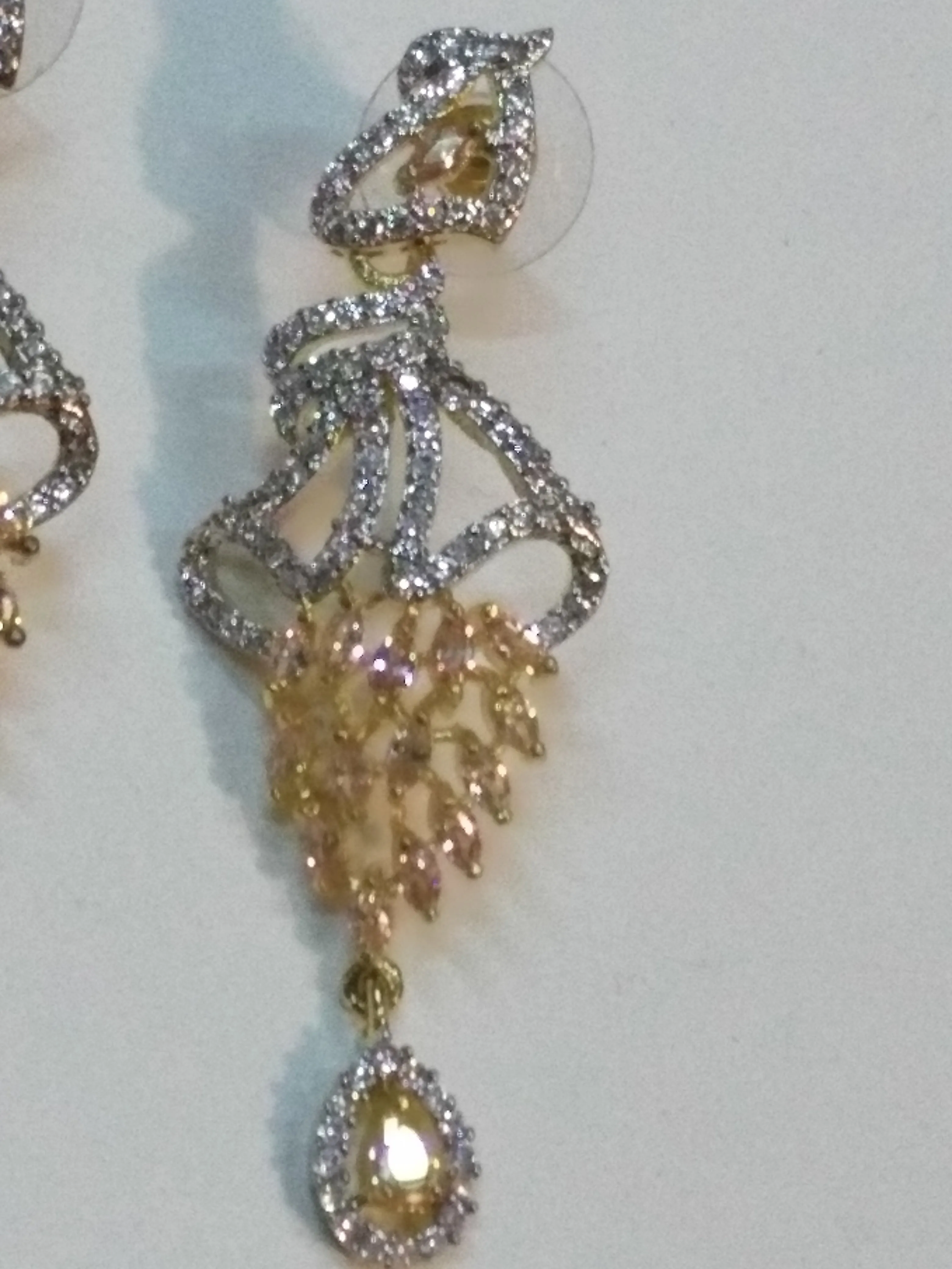 Inverted feather style champagne stones earrings