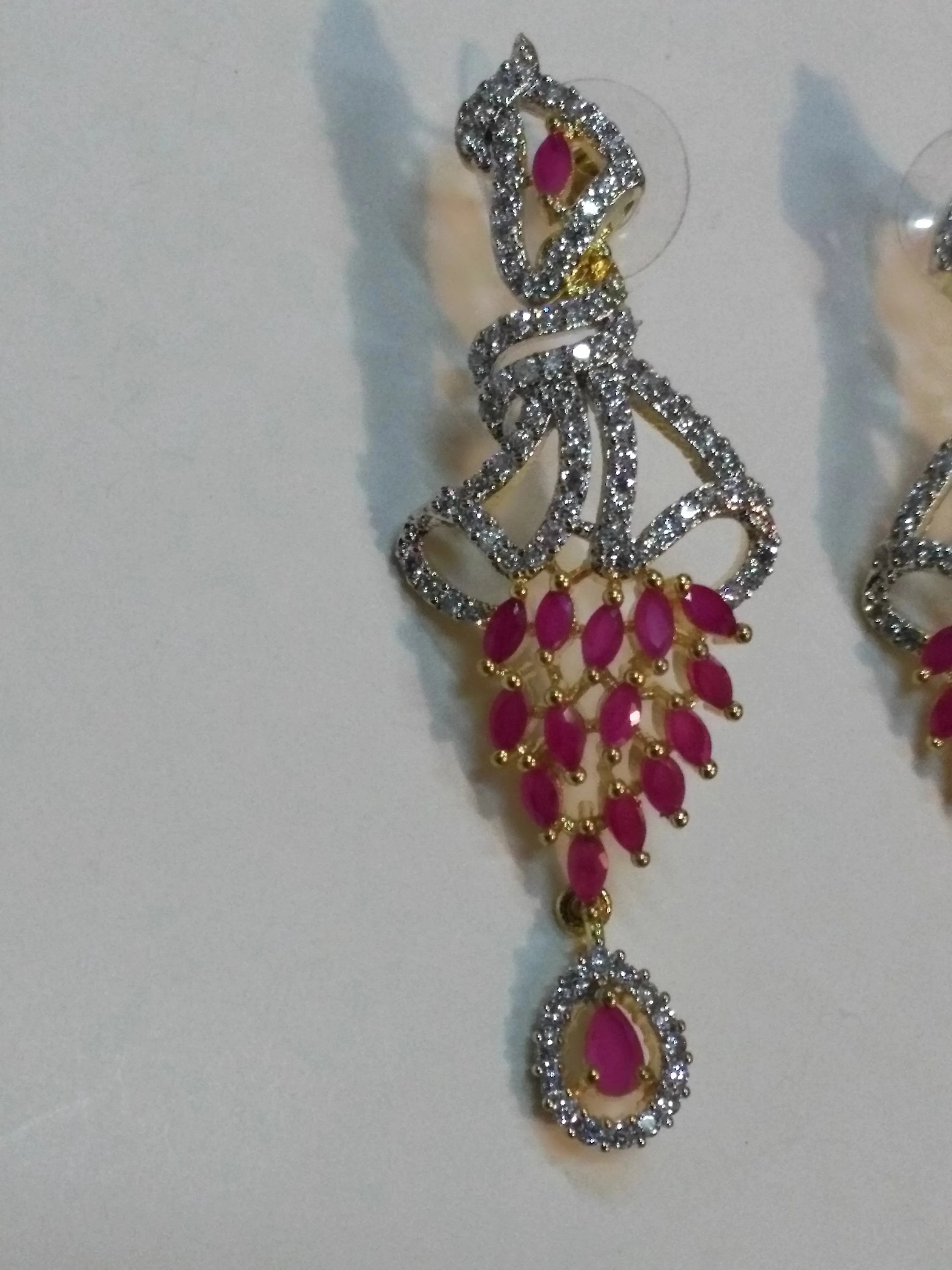 Inverted feather style champagne stones earrings